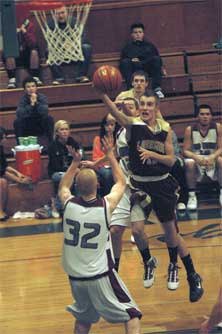 Lakewood senior Cameron Fry penetrates the Cedercrest defense and gets a layin.