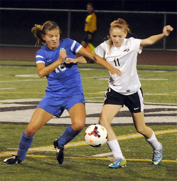 Marysville Getchell's Kyra Loe fights for possesion from Shorewood's Lisa Jensen.