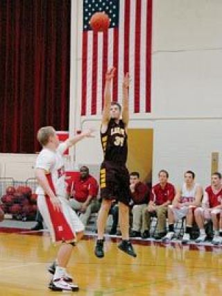 Senior forward Sean Noteboom shoots a jumper against a Kings defender Friday