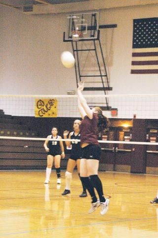 Setter Peyton Mizell gives another solid assist for the Cougars. Her overall play set up a number of easy kills for Lakewoods outside hitters.