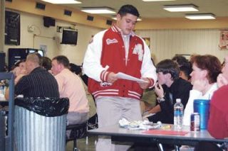 M-P defensive tackle Jamie Cruz reads his all-conference award. The senior received first team conference honors.