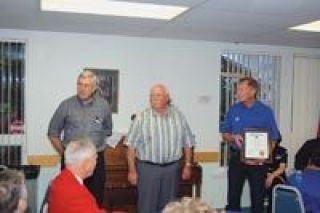 Thats two 50s for the Marysville Kiwanis; the service organization celebrated half-a-century in town with a reception and open house on Nov. 18. Here former Marysville School District superintendent Ray Harding receives the Legion of Honor award for 50 years of service from president Dave Voigt