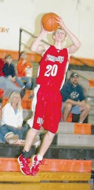 Senior guard Jared Stohl goes airborne for a shot attempt Friday