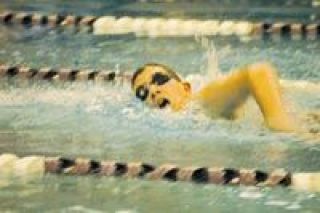 Class of 2010 John Vickery takes a breath during the freestyle leg of the 200-yard individual medley at the JV Championships Thursday