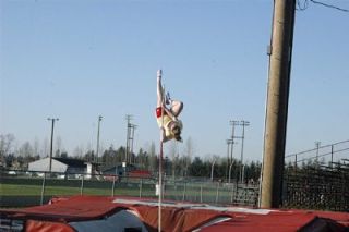 Senior pole vaulter Michaela Caldwell takes a leap at practice. Caldwell currently holds the school record at 10-9.