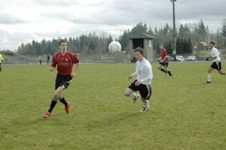 Midfielder Jeremy Webb quickly calculates his approach to a ball in midair.