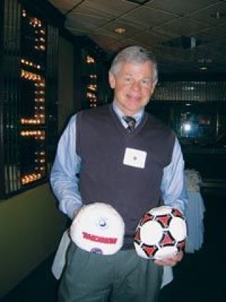 Steve Fulton shows off two of the (uninflated) Guatemalan hand-sewn soccer balls.