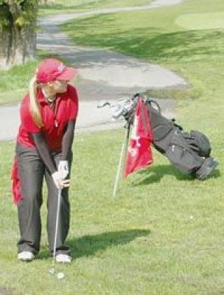 Sophomore Brielle Saunders lines up her shot to get as near the hole as possible.