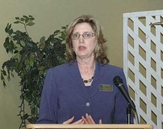 Soroptimist President Caroline Brown addresses the service groups membership during the annual dinner May 13.