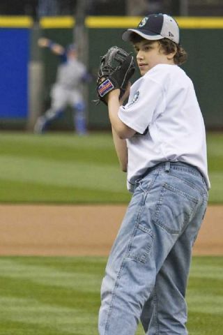 James Wilson throws the first pitch at Safeco Field May 7.