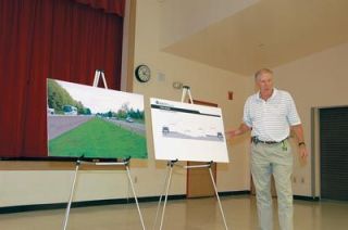 WSDOT assistant secretary John Conrad points to a drawing of how Interstate 5 will look after a $27 million fix to a 10-mile stretch of the median in the Marysville area. Engineers will add a concrete barrier to the northbound side of I-5 and keep a set of cable barriers on the southbound median. Theres something different going on in this stretch of freeway