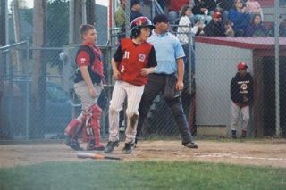 Marysvilles Andrew Alvis watches teammate Ryan Rices progress in the outfield. Rice batted in Alvis run