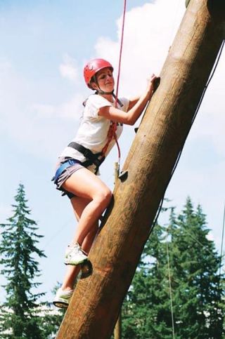 Varsity M-P solleyballer Emily Wiseman navigates the first leg of the vaunted alpine tower at the Jim Creek Naval facility near Arlington.