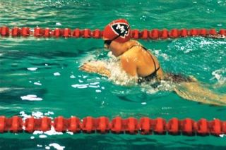 Leah Gordon takes a quick breath during her 2:35.71 individual medley performance against Snohomish. She placed fourth in the IM but fared better in a second-place showing in the 100 breaststroke.