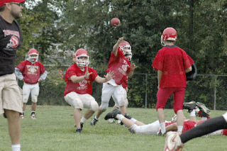 M-P senior Nick Forsythe passes the ball to wide receiver Levi Cartas