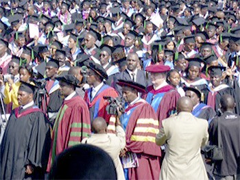 Marysville school board president Tom Albright walks among the thousands of graduates at the University of Kenya.