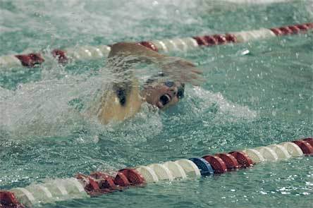 Senior Jason Pusateri swims the final leg of the 200 free relay.