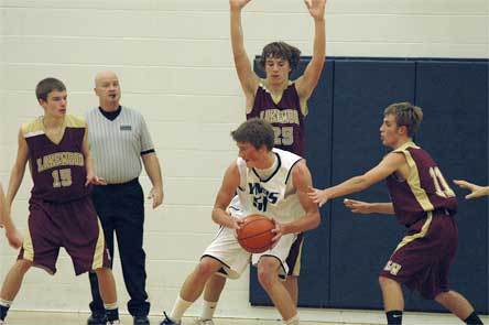 Sophomore guard Dustin Stanton stands tall in the paint on defense.