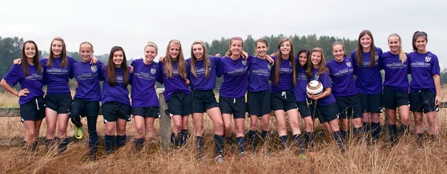 The Fuerza FC U14 team poses for a photo in their team color.