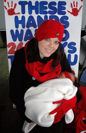 Marysville’s Ashley Drake holds her one-week-old daughter Laikyn