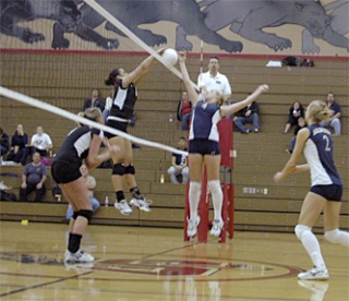 Arlington setter Kelsey Czaban hopes to catch Snohomish off guard by tipping the ball over the net.