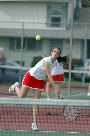 Courtney Coombs hits her service during the second set of the No. 2 singles match. Coombs defeated Allie Breaker