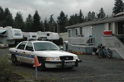 A Marysville Police vehicle remains stationed at the RV park in the 9800 block of State Avenue