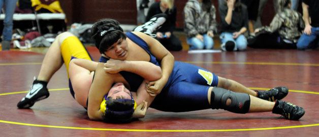 Arlington sophomore wrestler Brice Clariday pins his opponent at the Lakewood Jamboree on Nov. 30.