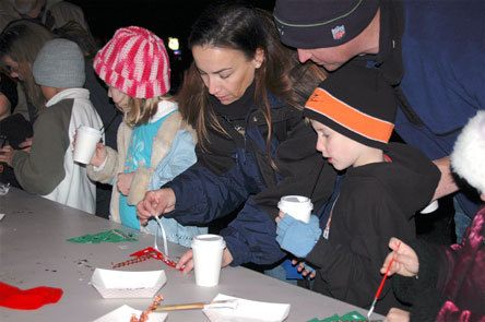 A family creates Christmas decorations during the 21st Annual Merrysville for the Holidays winter celebration Dec. 5.