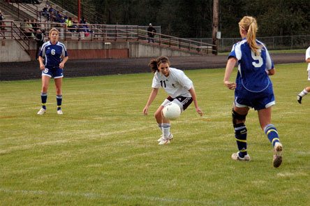 Junior midfielder Kelsey Anderson fights for possession and a chance at a cross inside the penalty box against South Whidbey.