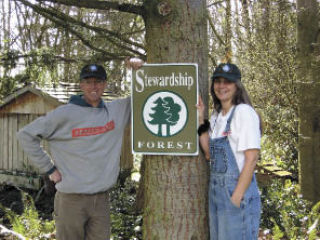 Forestland owners Ken and Elizabeth Zylstra of Stanwood proudly show off their newly recognized status as a Stewardship Forest