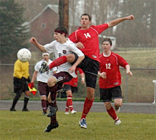 Lakewood sophomore Brandon Ochoa tussles with Archbishop Murphy mid Erik Schmidt.