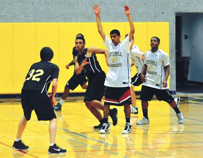 Marysville Getchell junior guard/forward Ali Al-Azadi puts his hands up to defend the perimeter in practice on Nov. 22.