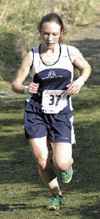 Arlington senior Safa Pinkens keeps focused as she turns in a 13th-place finish at the Wesco championships at Lakewood High School.