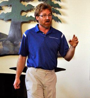 James Wells makes a demonstration on the potentially negative impacts of a proposed coal export facility on the city of Marysville.