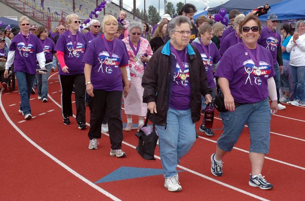 Cancer survivors take to the track of the Marysville-Pilchuck High School stadium for the first lap of this year’s Marysville-Tulalip Relay For Life on June 9.