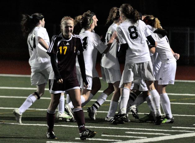 Taylor Studzinski walks off the field after Klahowya celebrates an overtime goal.