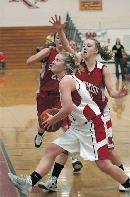 Junior guard Morgan Martinis drives baseline