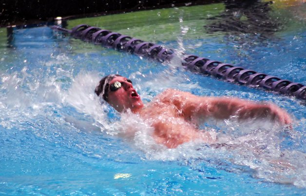 M-P’s Colin Willis competes in the 100-yard backstroke at the WIAA State Swim and Dive Meet on Saturday