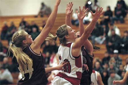 Guard Andi Adams goes up with the Cascade trees for a lay-in.