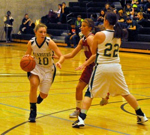 MG freshman pointguard Gabby Grandbois dribbles into Stanwood territory.