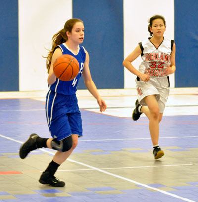 Senior guard Julie Bethune leads the Eagles’ offense down court against Highland Christian.