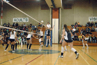 Senior setter Kelsey Czaban sells the set but taps the ball onto Shorewood’s court instead.