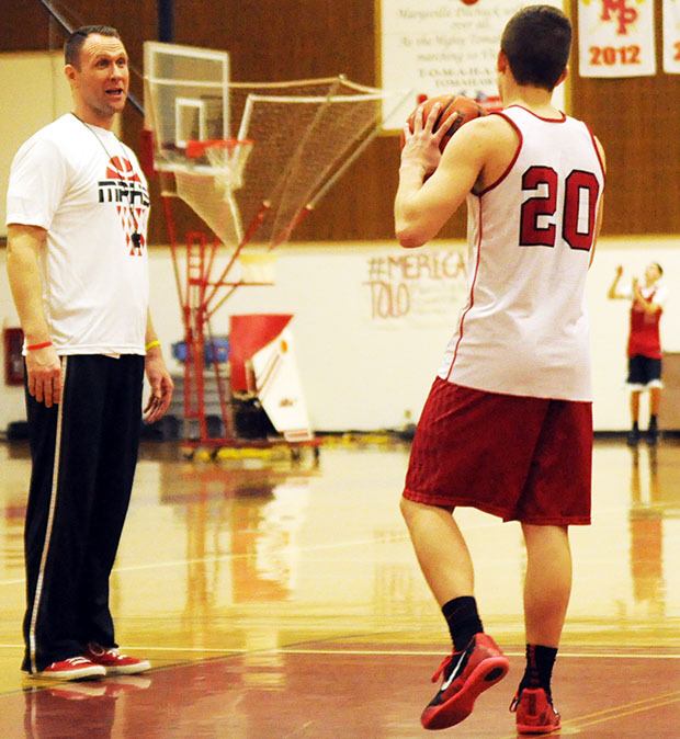 Marysville-Pilchuck's Bary Gould coaches a player during practice as the Tomahawks' enter the regional state playoff game against Kennewick Feb. 28.