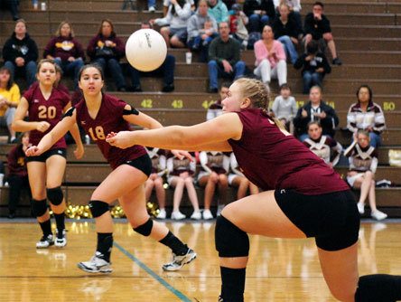 Kaylee Diggs passes the ball to setter Samantha Adams