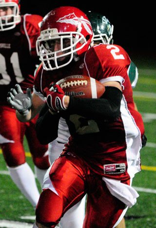 Kyle Miller runs for a long gain against Edmonds Woodway. Miller