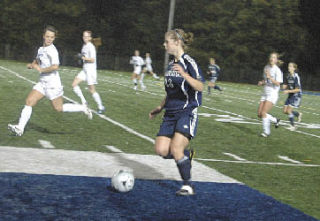 Arlington junior Kristina Longosky dribbles the ball in the Eagles’ loss to Shorewood.