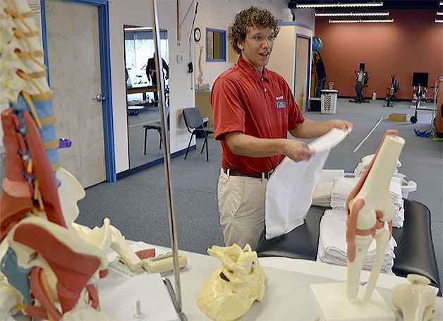 Brock Kipperpert folds towels at Summit Physical Therapy in Marysville. He is one of the few students in the age 18-21 special education transition program who has been able to land a job. Organizers hope others businesses will step up and give other students a chance.