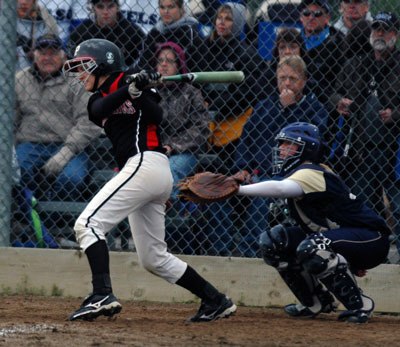 Shortstop Megan Rollings puts a ball in play against Kelso.