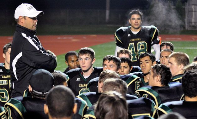 Chargers head coach Davis Lura addresses his team after a 44-8 loss to Lynnwood on Oct. 14.